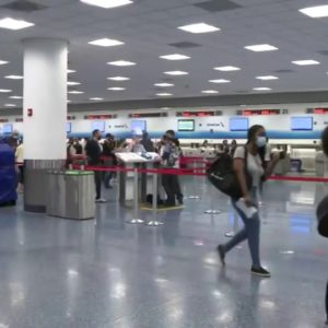 Frustrated passengers at Miami International Airport due to American Airlines cancellations